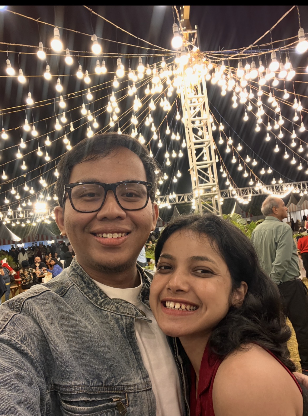 Purnanga and Sudeshna under a canopy of fairy lights